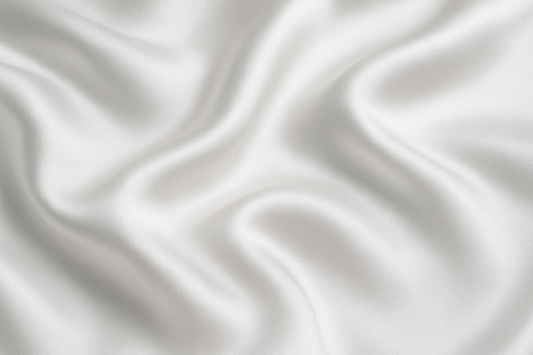 Close-up of 100% mulberry silk fabric from the OpenAir L-Shaped Pillowcase, showing smooth 19 momme texture for skin and hair benefits.