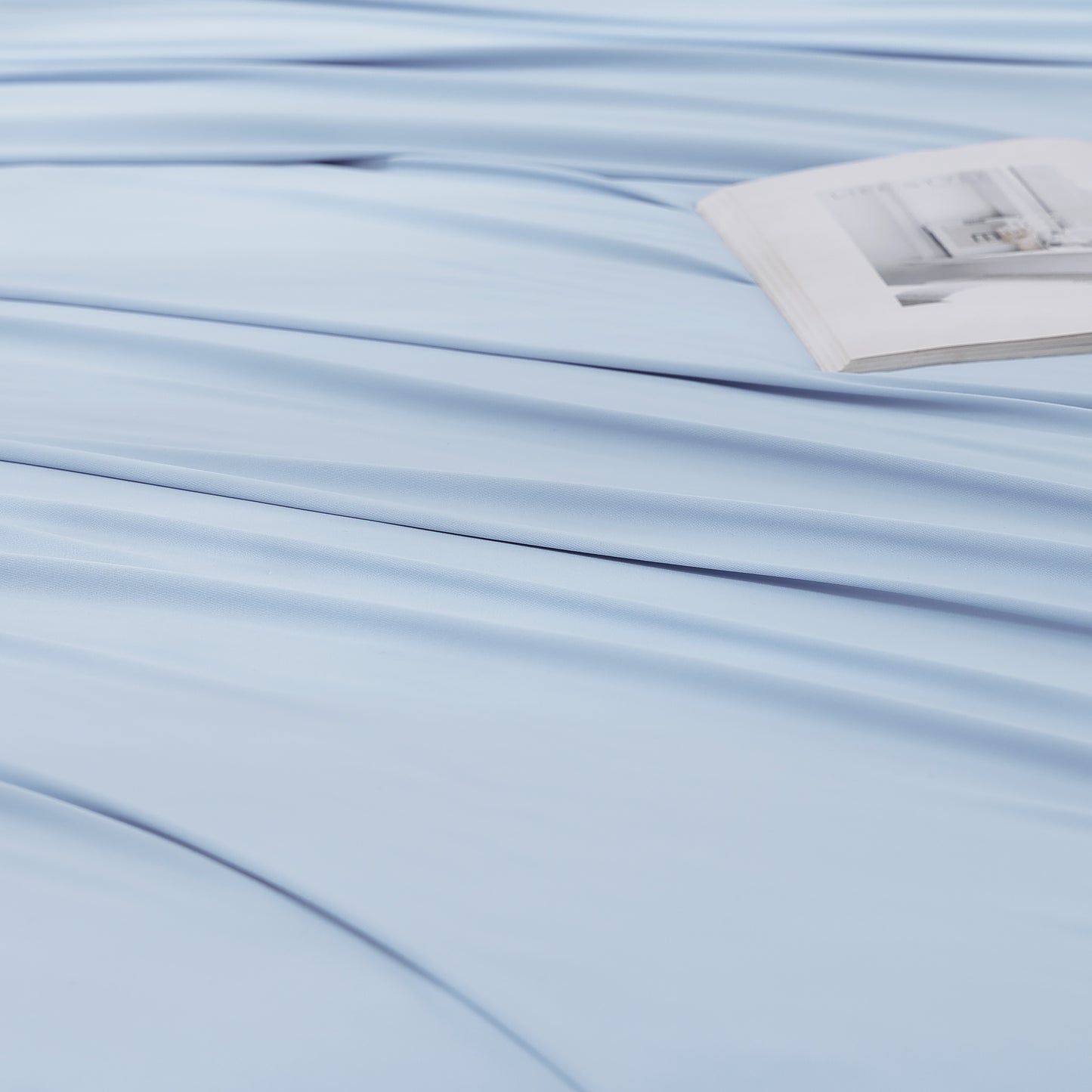 Close-up of blue cooling fabric on the OpenAir L-Shaped Pillowcase, highlighting smooth, breathable texture.
